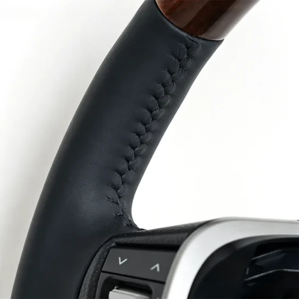 detail of toyota wood grain steering wheel